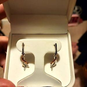 14 kt white and rose gold shimmering diamond earrings.